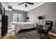 Contemporary bedroom with hardwood floors and a large window for natural light at 5347 N College Ave # Apt 109, Indianapolis, IN 46220