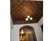 Decorative patterned ceiling with a vintage-style chandelier at 5347 N College Ave # Apt 109, Indianapolis, IN 46220