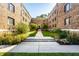 Beautiful courtyard view between brick apartment buildings with manicured landscaping at 5347 N College Ave # Apt 109, Indianapolis, IN 46220