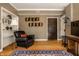 Charming living room with built-in bookshelves, hardwood floors, and a classic rug at 5347 N College Ave # Apt 109, Indianapolis, IN 46220