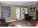 Cozy living room with hardwood floors and an abundance of natural light at 5347 N College Ave # Apt 109, Indianapolis, IN 46220