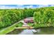 Stunning aerial view of lakeside home with private dock and lush green surroundings at 5571 Poff Rd, Martinsville, IN 46151