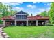 Spacious backyard featuring a large patio, outdoor seating, and stone accents at 5571 Poff Rd, Martinsville, IN 46151