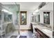 Elegant bathroom featuring a glass shower, double vanity and a large mirror at 5571 Poff Rd, Martinsville, IN 46151