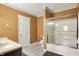 Standard bathroom with a shower-tub combo, single vanity, and a white door at 5571 Poff Rd, Martinsville, IN 46151