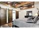 Bedroom boasts ceiling details, wood floors, sliding barn door to closet, and a queen size bed at 5571 Poff Rd, Martinsville, IN 46151