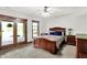 Warm and inviting bedroom featuring sliding glass doors and outdoor views of the lake at 5571 Poff Rd, Martinsville, IN 46151