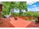 Expansive wooden deck with outdoor furniture and scenic lake views at 5571 Poff Rd, Martinsville, IN 46151