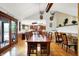 Spacious dining room features wooden floors, large table and chairs, and plenty of natural light at 5571 Poff Rd, Martinsville, IN 46151