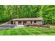 The exterior shows an attached garage, deck, and beautiful landscaping at 5571 Poff Rd, Martinsville, IN 46151