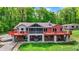Beautiful two-story home with a large deck overlooking the landscaped backyard and hot tub at 5571 Poff Rd, Martinsville, IN 46151