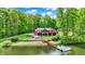 A charming waterfront home with a private dock and lush green landscaping at 5571 Poff Rd, Martinsville, IN 46151