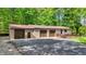 Spacious three-car garage with a rear deck, offering ample parking and outdoor entertaining space at 5571 Poff Rd, Martinsville, IN 46151