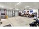 Spacious garage featuring multiple garage doors, concrete floors, and ample space for vehicles and hobbies at 5571 Poff Rd, Martinsville, IN 46151