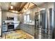 Charming kitchen with gray cabinetry, stainless appliances, and a designer ceiling at 5571 Poff Rd, Martinsville, IN 46151