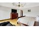 Spacious primary bedroom featuring a large dresser and hardwood floors, offering a luxurious retreat at 5571 Poff Rd, Martinsville, IN 46151