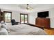 Relaxing primary bedroom with a walk out to the deck and spacious seating for reading or TV viewing at 5571 Poff Rd, Martinsville, IN 46151