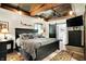 Spacious main bedroom with wood floors, ample lighting, and en suite bathroom at 5571 Poff Rd, Martinsville, IN 46151