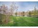 Picturesque backyard leading to a serene lake, perfect for nature lovers at 601 Terrace Lake Dr, Columbus, IN 47201