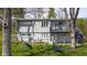 Backyard featuring mature trees, a swing set and access to the lake at 601 Terrace Lake Dr, Columbus, IN 47201