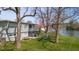 Scenic backyard featuring a large deck, picnic area, and playground with lake view at 601 Terrace Lake Dr, Columbus, IN 47201
