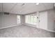 Finished basement featuring neutral walls, carpet, and windows for natural light at 601 Terrace Lake Dr, Columbus, IN 47201