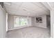Spacious finished basement featuring large windows, carpet, and TV entertainment area at 601 Terrace Lake Dr, Columbus, IN 47201