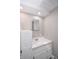 Bathroom featuring a white vanity with ample storage and a neutral color scheme at 601 Terrace Lake Dr, Columbus, IN 47201