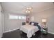 Cozy bedroom features a ceiling fan, natural light, and calming neutral tones at 601 Terrace Lake Dr, Columbus, IN 47201