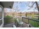 A covered deck with views of the lake offers an inviting outdoor space for relaxation and enjoying the beautiful scenery at 601 Terrace Lake Dr, Columbus, IN 47201