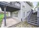 Lower level patio with stairs to deck, and lake views at 601 Terrace Lake Dr, Columbus, IN 47201
