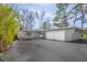 Charming gray home featuring a two-car garage, inviting entrance, and ample parking on a sunny day at 601 Terrace Lake Dr, Columbus, IN 47201