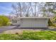 Exterior side view of a well-maintained home with a spacious driveway and green lawn at 601 Terrace Lake Dr, Columbus, IN 47201