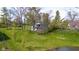 Charming home featuring a sprawling lawn, mature trees, and access to a serene lake at 601 Terrace Lake Dr, Columbus, IN 47201