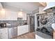 Updated kitchen features stainless steel appliances, granite countertops, and stylish backsplash at 601 Terrace Lake Dr, Columbus, IN 47201