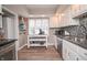 Bright and modern kitchen offers stainless appliances and ample counter space at 601 Terrace Lake Dr, Columbus, IN 47201