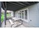 Covered patio featuring a picnic table, ideal for outdoor dining and entertaining at 601 Terrace Lake Dr, Columbus, IN 47201