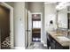 Bathroom with vanity and marble countertop and view to main bedroom at 6019 Timberbend Dr, Avon, IN 46123