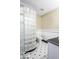 Modern bathroom with a glass block shower and stylish black and white tile at 6019 Timberbend Dr, Avon, IN 46123