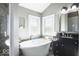 Relaxing bathroom featuring a soaking tub, a glass-enclosed shower, and tasteful decor at 6019 Timberbend Dr, Avon, IN 46123