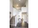Grand foyer with staircase, elegant table, tile flooring, and an open view at 6019 Timberbend Dr, Avon, IN 46123