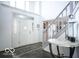 Inviting foyer featuring tile floors, staircase, decorative table, and natural light at 6019 Timberbend Dr, Avon, IN 46123