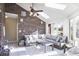 Bright sunroom featuring brick walls, tile flooring, and comfortable seating with backyard views at 6019 Timberbend Dr, Avon, IN 46123
