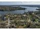 Scenic aerial view of the neighborhood, showcasing the lake, lush trees, and the community layout at 6140 Buttonwood Dr, Noblesville, IN 46062