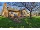 Brick home featuring a patio with outdoor seating, perfect for entertaining in the landscaped backyard at 6140 Buttonwood Dr, Noblesville, IN 46062