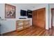 This bedroom offers hardwood floors, a tv, and shelf space providing a practical and comfortable space at 6140 Buttonwood Dr, Noblesville, IN 46062