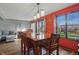 Formal dining room features hardwood floors, windows with outdoor views, and modern lighting at 6140 Buttonwood Dr, Noblesville, IN 46062