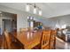 Open dining area featuring a wooden table and hardwood floors at 6140 Buttonwood Dr, Noblesville, IN 46062