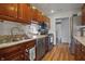 Well-appointed kitchen with stainless steel appliances and warm wood cabinetry at 6140 Buttonwood Dr, Noblesville, IN 46062