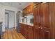 Traditional kitchen featuring wood cabinets, stainless steel refrigerator, and hardwood floors at 6140 Buttonwood Dr, Noblesville, IN 46062